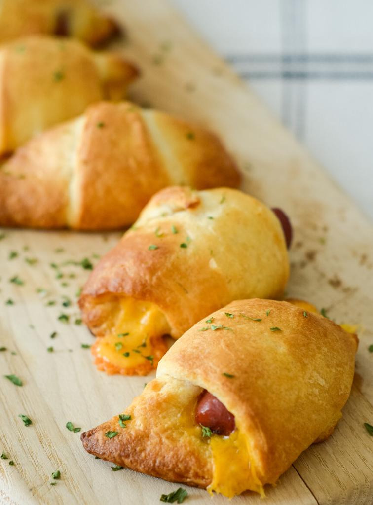 This image shows air fryer pigs in a blanket with cheese made in 8 minutes in the air fryer.